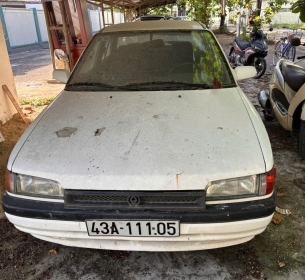 TS10: 01 (một) xe ô tô đã qua sử dụng nhãn hiệu MAZDA; số loại: 323, biển kiểm soát số: 43A-111.05; số chỗ ngồi: 05 chỗ; màu sơn: Trắng; năm/nước sản xuất: 1995/Việt Nam; số khung: BG1062-MH001578; số máy: B6-510774 Lần 2